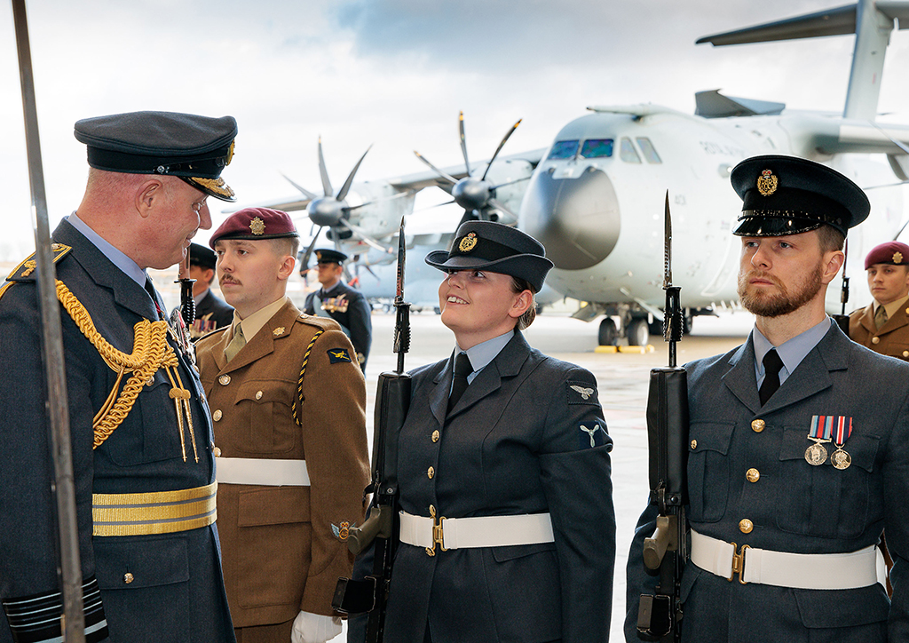 Chief of Air Staff, Air Chief Marshal Harv Smyth, talks with a RAF Brize Norton personnel, while reviewing the parade.